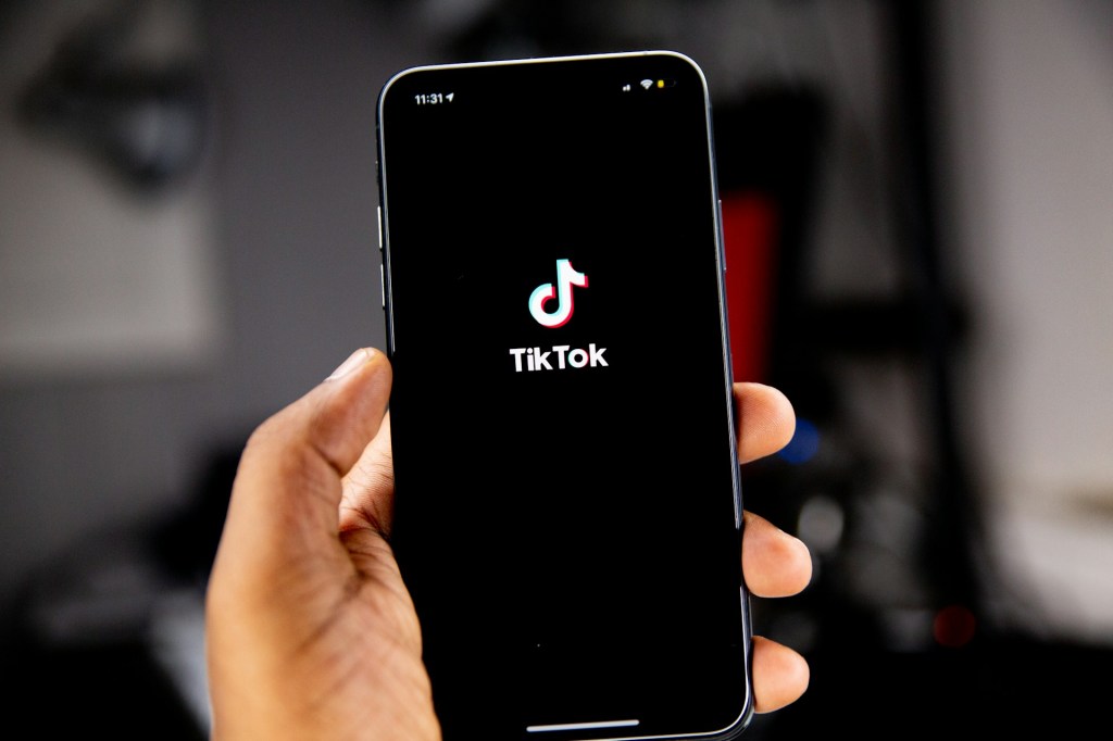 A cell phone with the TikTok app open.