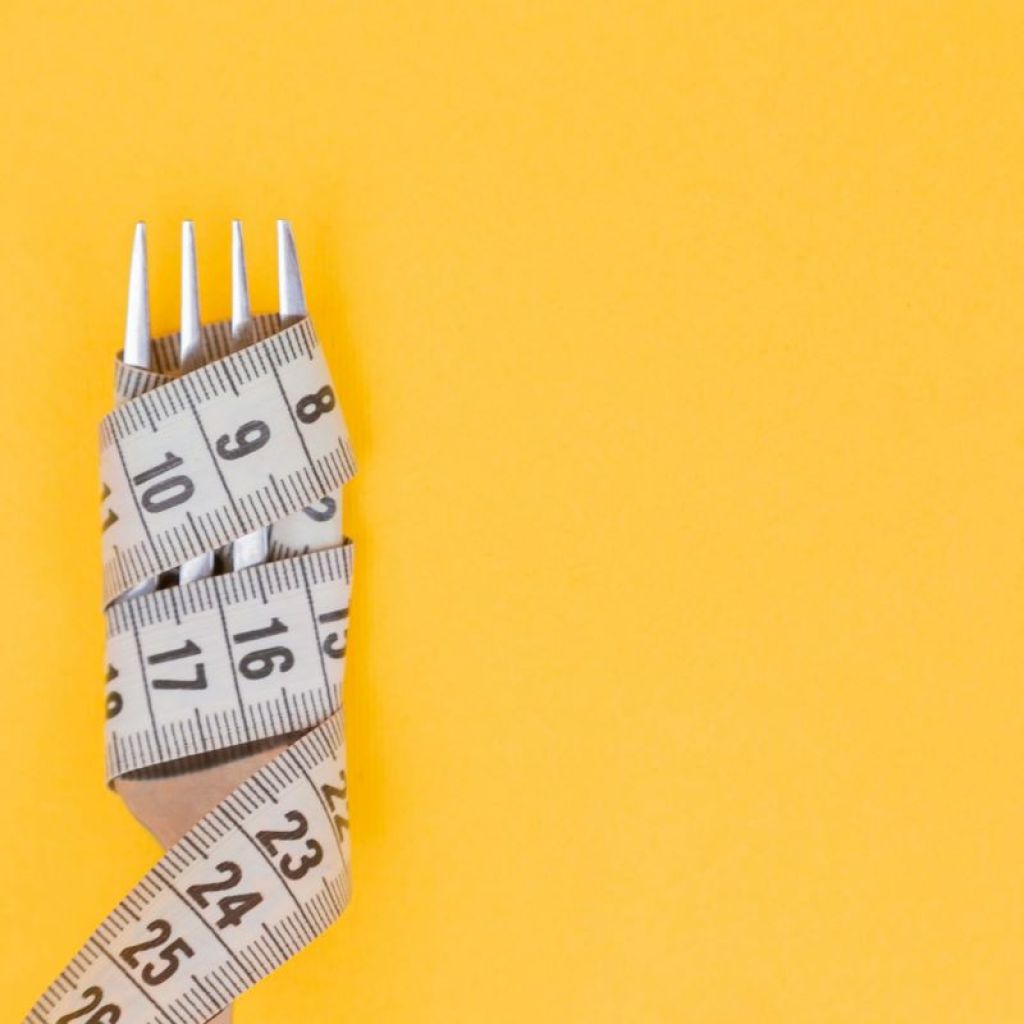 Measuring tape around a fork