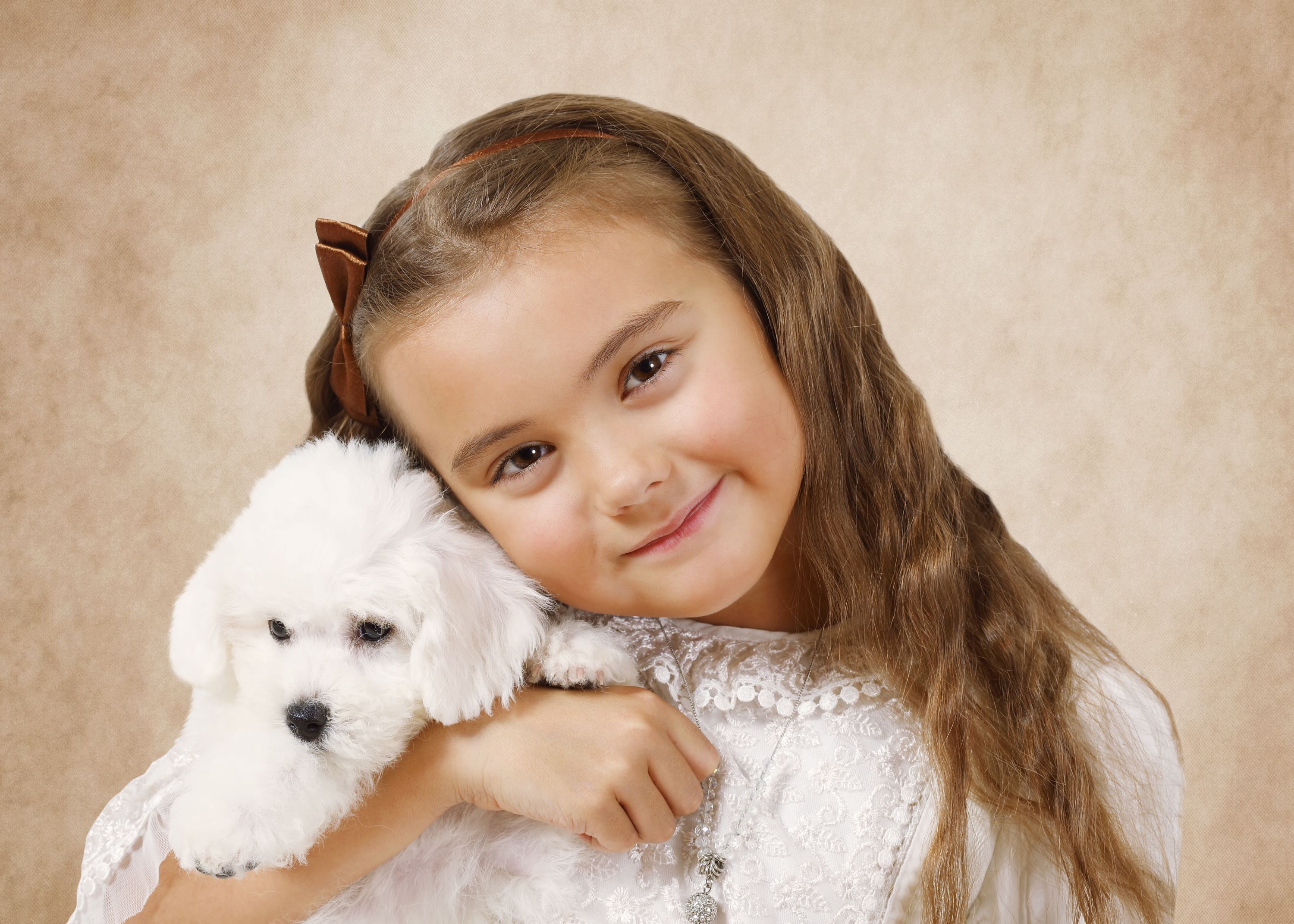 Girl with bichon puppy