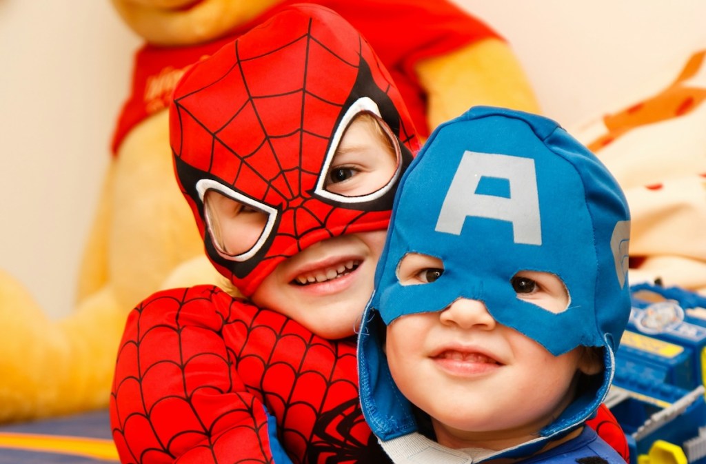 kids dressed up like super heroes