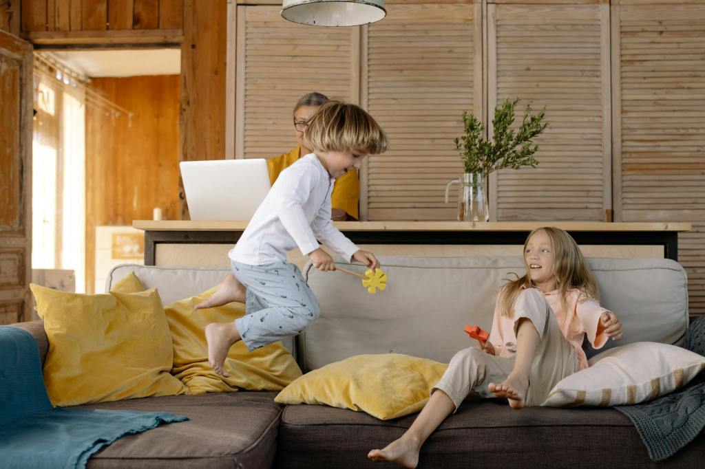 Kids jumping around on the furniture.