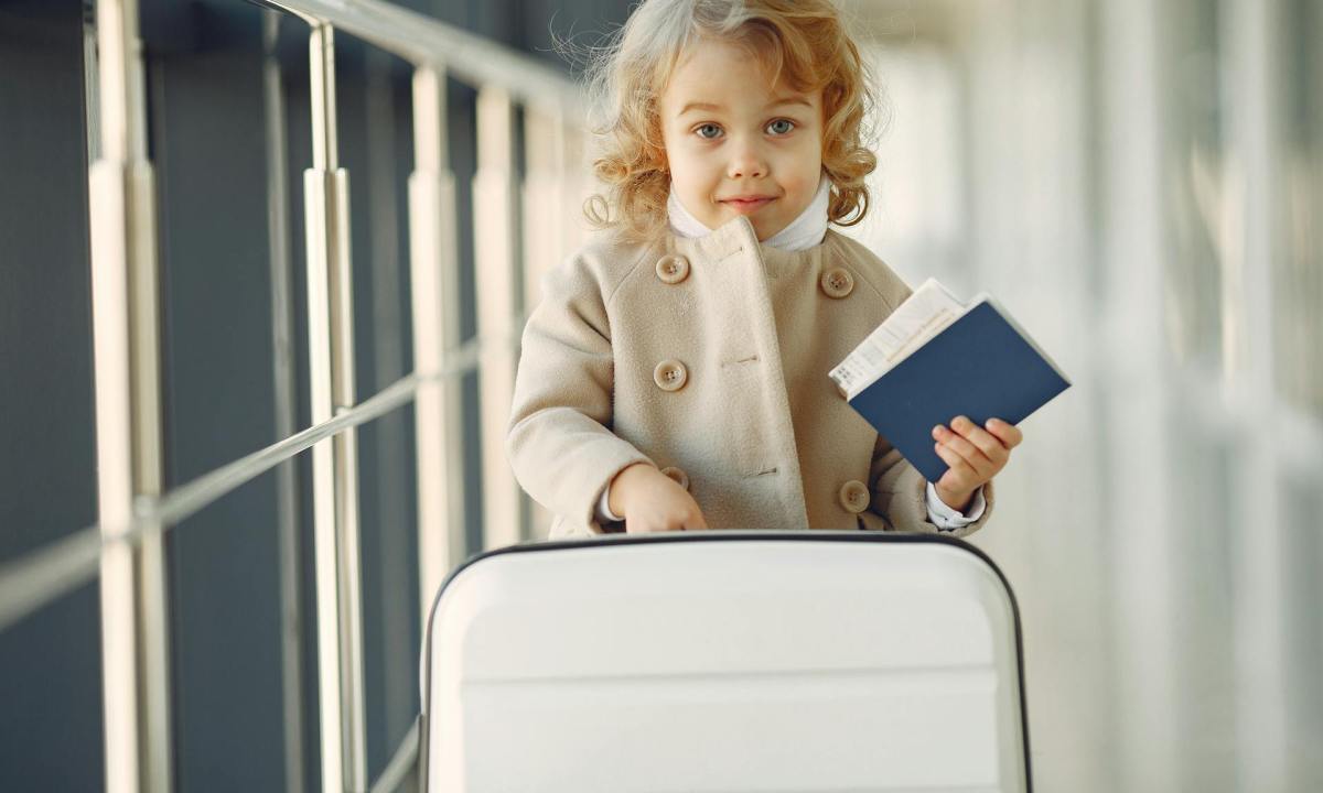A child with their passport at the airport