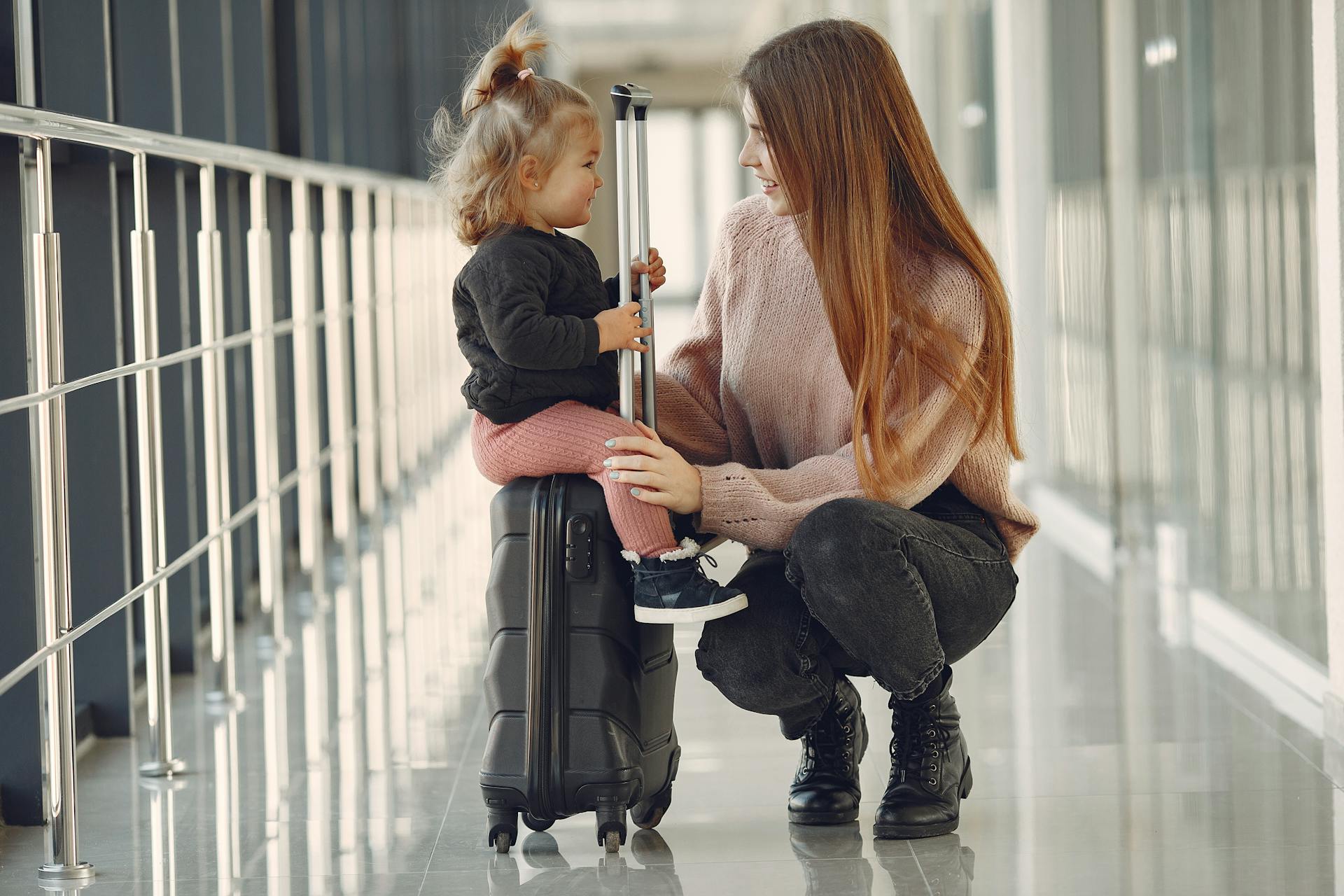 A parent and child at the airport.
