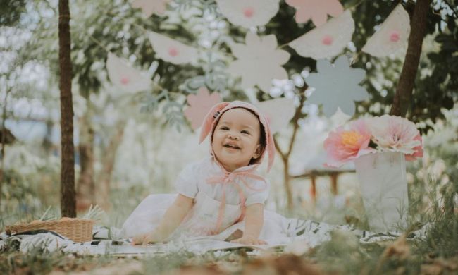Happy baby girl outside on spring day
