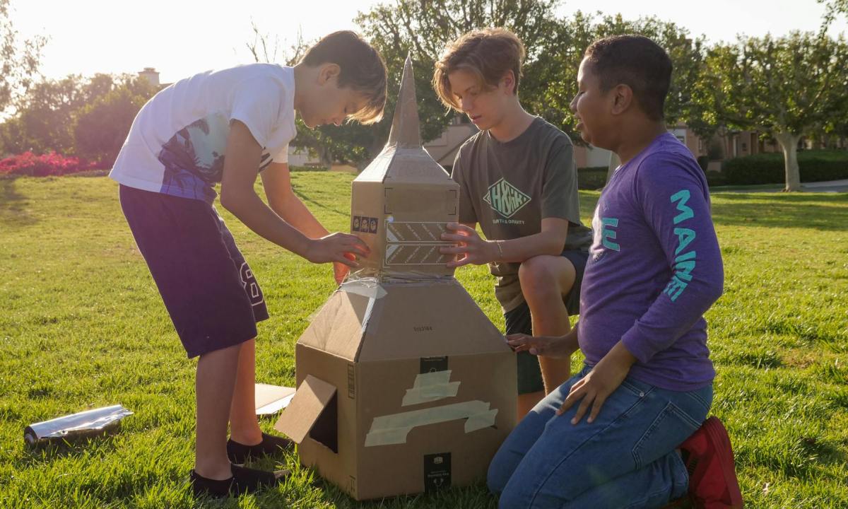 Children building cardboard STEM project