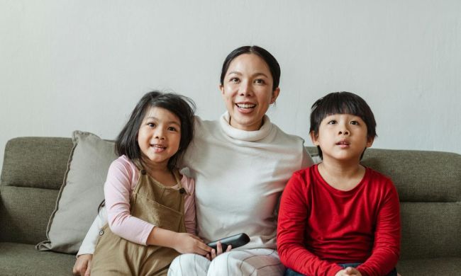 Mom and kids enjoying a movie
