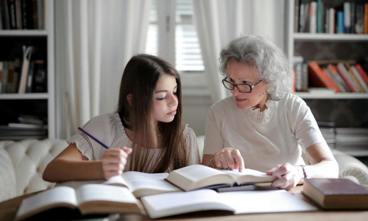 Parent helping teen with homework
