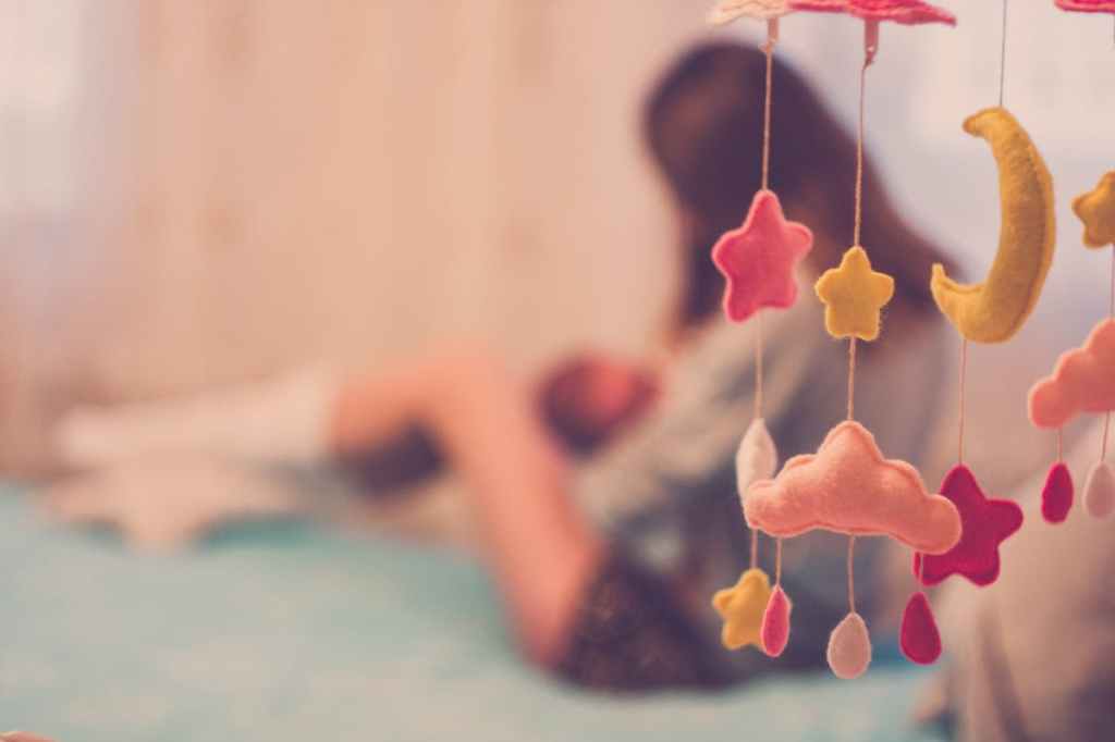 mom baby in nursery